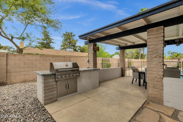 4840 E Sunnyside Dr, Scottsdale, AZ 85254 - view of patio featuring exterior kitchen, a fenced backyard, and a grill
