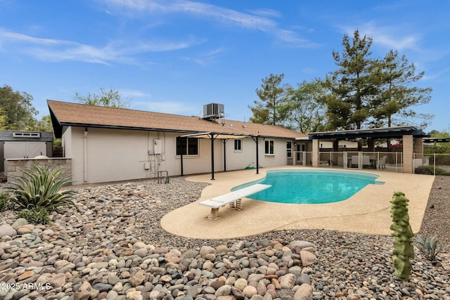 4840 E Sunnyside Dr, Scottsdale, AZ 85254 - view of pool with central air condition unit, fence, a diving board, a patio, and a fenced in pool