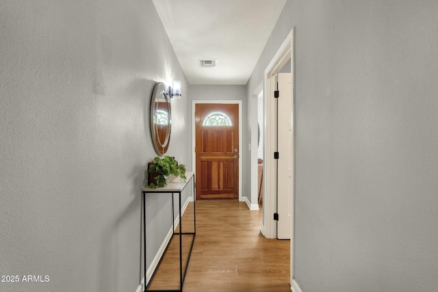 4840 E Sunnyside Dr, Scottsdale, AZ 85254 - doorway to outside with baseboards, wood finished floors, and visible vents