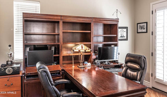 office area with light wood-style floors