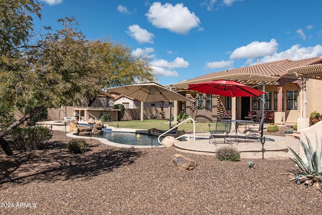 view of yard with a pergola, a patio area, fence, and a fenced in pool