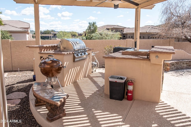 view of patio / terrace with a grill, a fenced backyard, and area for grilling