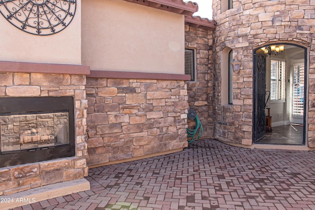 view of patio / terrace with an outdoor stone fireplace