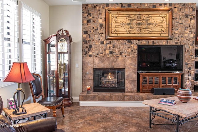 living room with a tiled fireplace