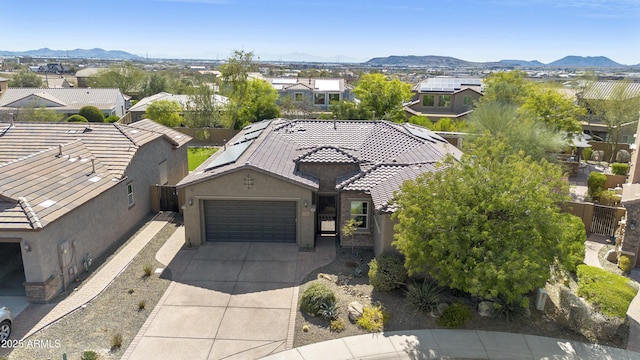 drone / aerial view featuring a residential view and a mountain view