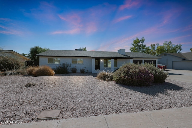 ranch-style home with a garage