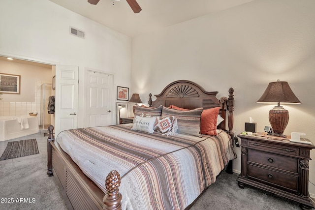 bedroom with carpet floors, ensuite bath, visible vents, and a ceiling fan