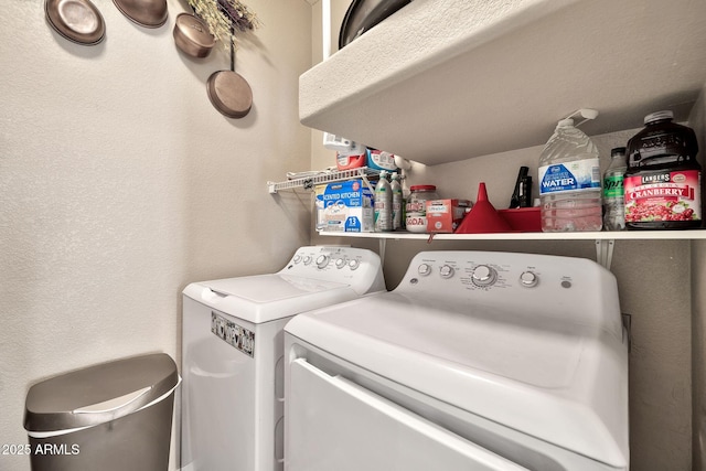 clothes washing area featuring laundry area and washing machine and dryer