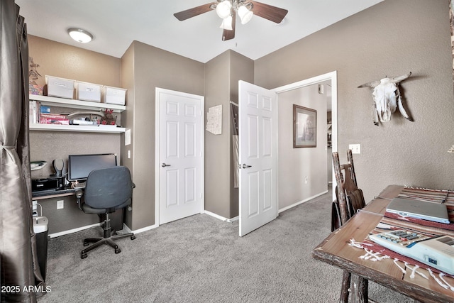 office with carpet floors, baseboards, and a ceiling fan