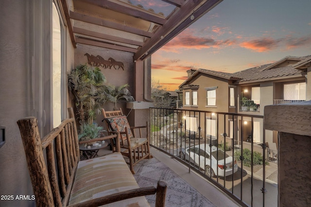 view of balcony at dusk