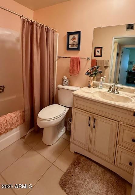 bathroom with visible vents, toilet, tile patterned flooring, vanity, and a shower with curtain