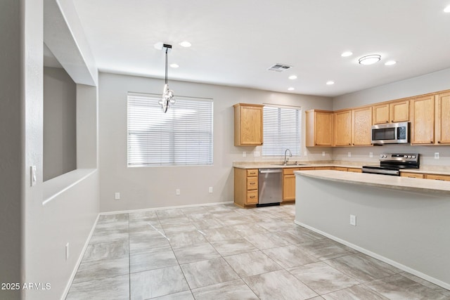 3013 W Via De Pedro Miguel, Phoenix, AZ 85086 - kitchen featuring stainless steel appliances, light countertops, recessed lighting, hanging light fixtures, and light brown cabinetry
