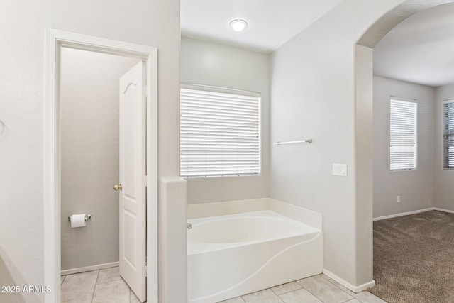 3013 W Via De Pedro Miguel, Phoenix, AZ 85086 - bathroom featuring a garden tub and tile patterned floors