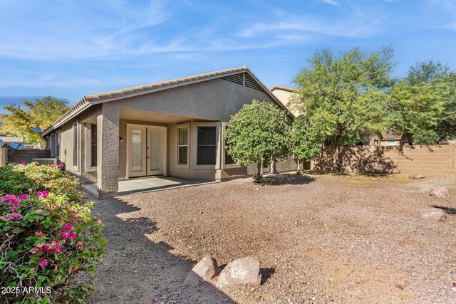 3013 W Via De Pedro Miguel, Phoenix, AZ 85086 - rear view of property with stucco siding, french doors, and a tiled roof
