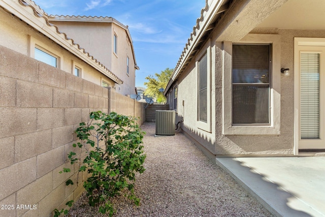 3013 W Via De Pedro Miguel, Phoenix, AZ 85086 - view of side of home featuring a fenced backyard, stucco siding, and a patio