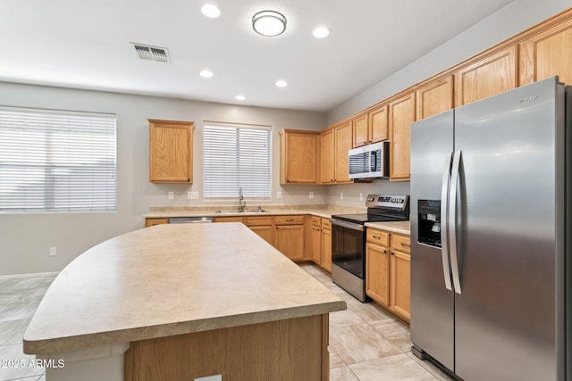 3013 W Via De Pedro Miguel, Phoenix, AZ 85086 - kitchen featuring stainless steel appliances, recessed lighting, a center island, and light countertops