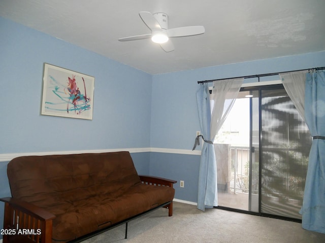 sitting room featuring carpet flooring and ceiling fan