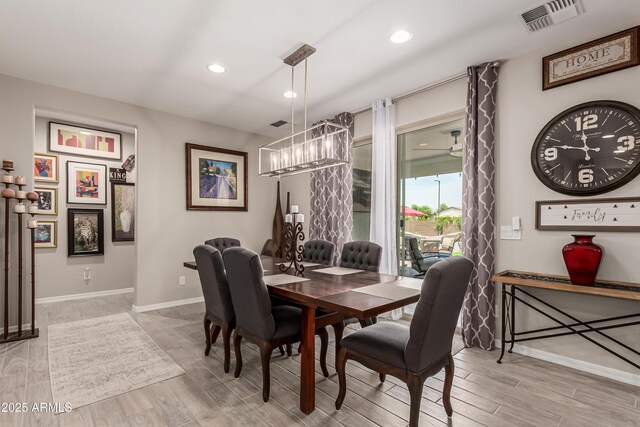 dining space featuring an inviting chandelier, light wood finished floors, recessed lighting, baseboards, and visible vents
