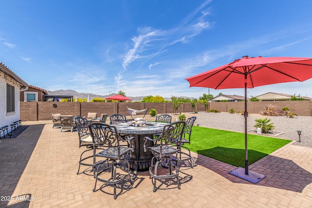 view of patio featuring a fenced backyard and outdoor dining space