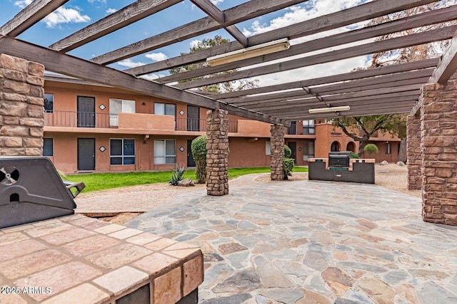 view of patio / terrace featuring a pergola and area for grilling