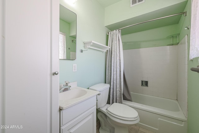 full bathroom with tile patterned floors, vanity, shower / tub combo, and toilet