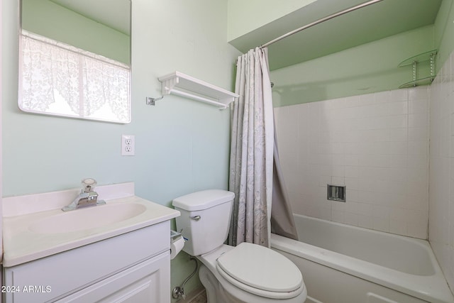 full bathroom featuring vanity, shower / bath combination with curtain, and toilet