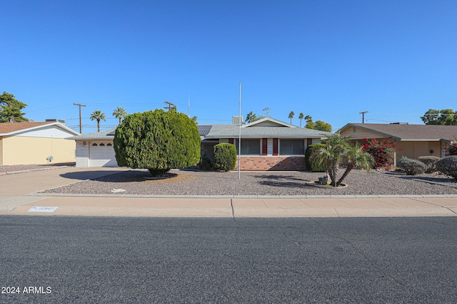 single story home with a garage