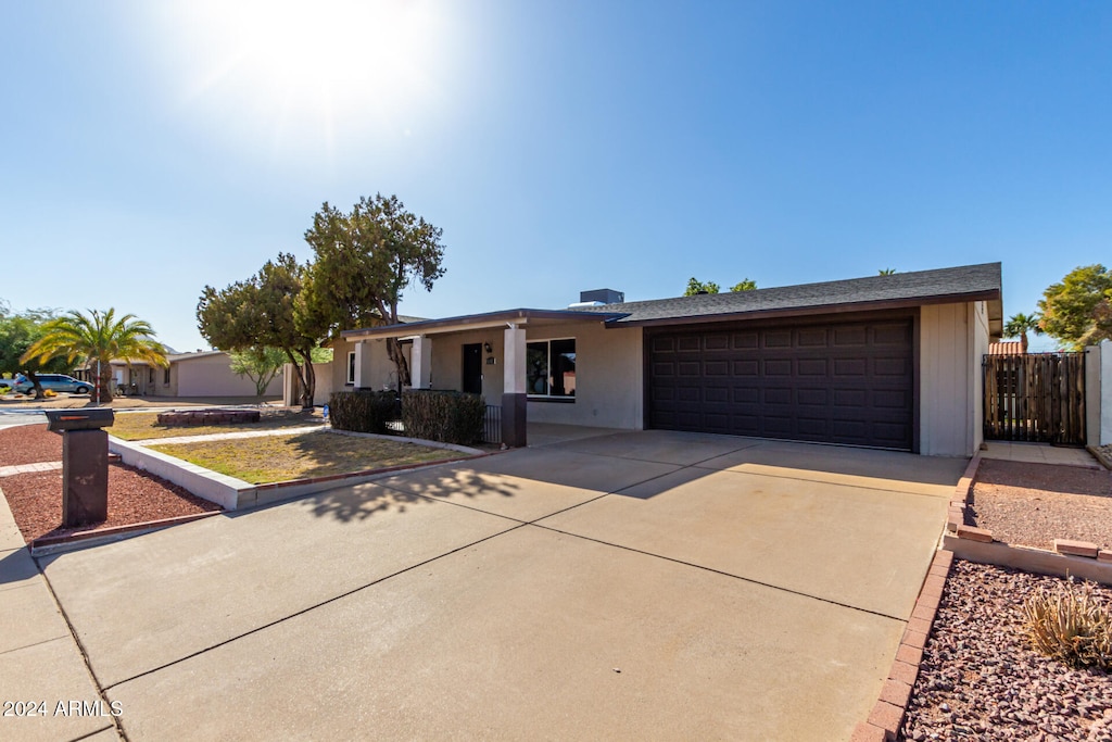 single story home featuring a garage