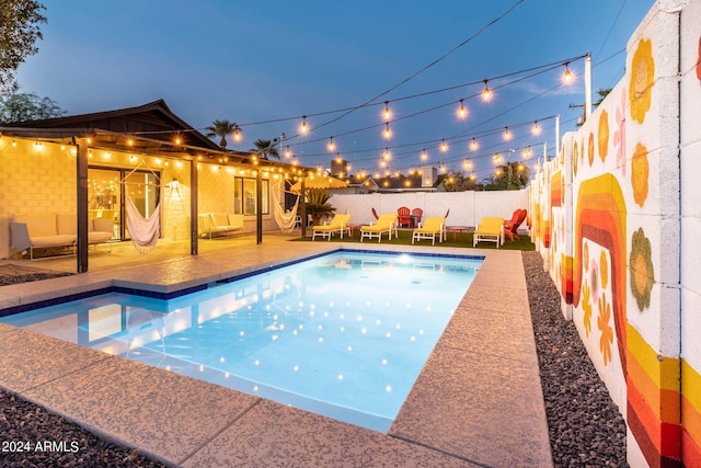 view of swimming pool featuring a patio area