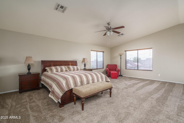 carpeted bedroom featuring visible vents, lofted ceiling, baseboards, and a ceiling fan