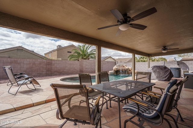 view of patio / terrace with ceiling fan, a fenced backyard, a fenced in pool, and outdoor dining space