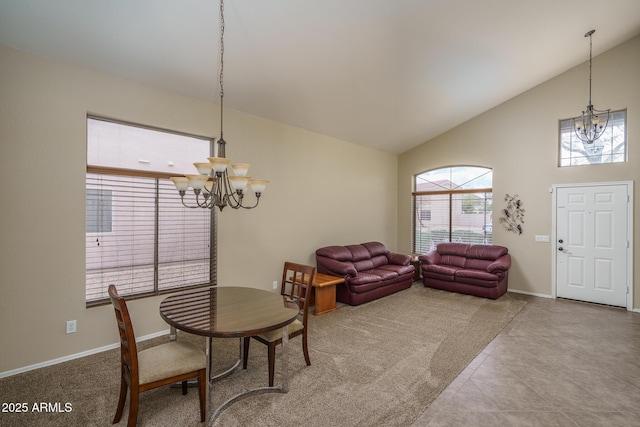 dining room with baseboards, a notable chandelier, and high vaulted ceiling