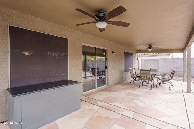 view of patio / terrace featuring outdoor dining area, a ceiling fan, and fence