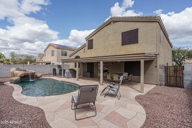 view of pool with a gate, a patio area, a fenced in pool, and a fenced backyard