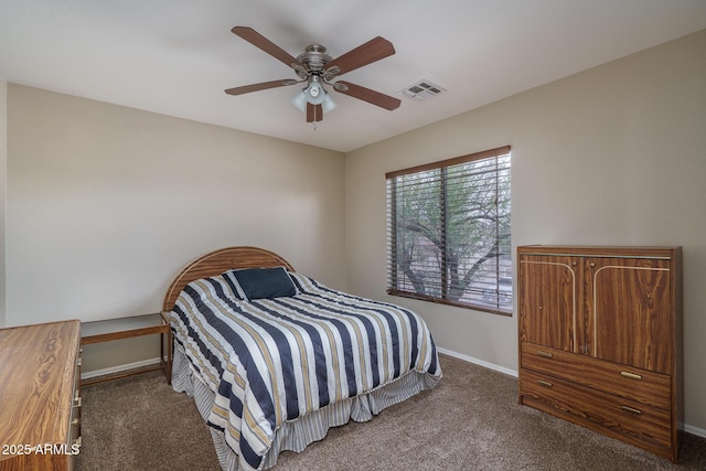 carpeted bedroom with baseboards, visible vents, and ceiling fan