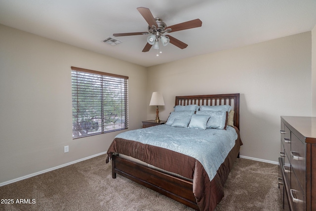 bedroom featuring visible vents, dark carpet, and baseboards