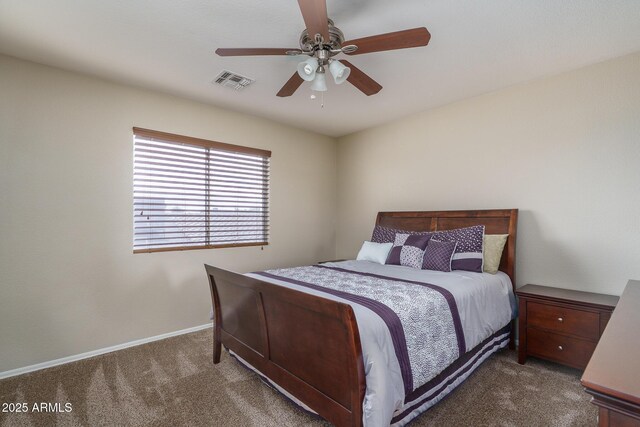 carpeted bedroom with a ceiling fan, baseboards, and visible vents