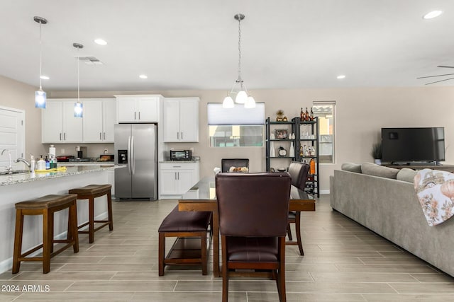 1906 W Lariat Ln, Phoenix, AZ 85085 - dining area with wood tiled floor, visible vents, and recessed lighting