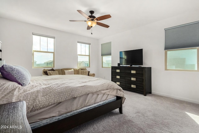 1906 W Lariat Ln, Phoenix, AZ 85085 - bedroom featuring light carpet, baseboards, and a ceiling fan