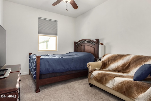 bedroom with ceiling fan and light colored carpet