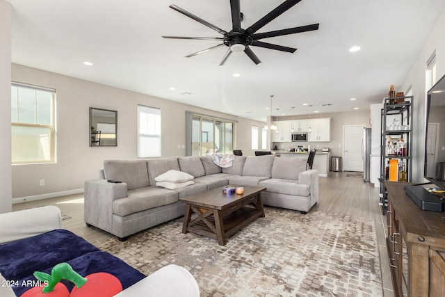 1906 W Lariat Ln, Phoenix, AZ 85085 - living area with baseboards, light wood-style flooring, ceiling fan, and recessed lighting