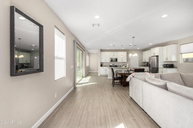 1906 W Lariat Ln, Phoenix, AZ 85085 - living area featuring baseboards, visible vents, recessed lighting, and a notable chandelier