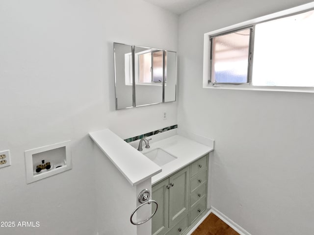 bathroom with vanity and wood-type flooring