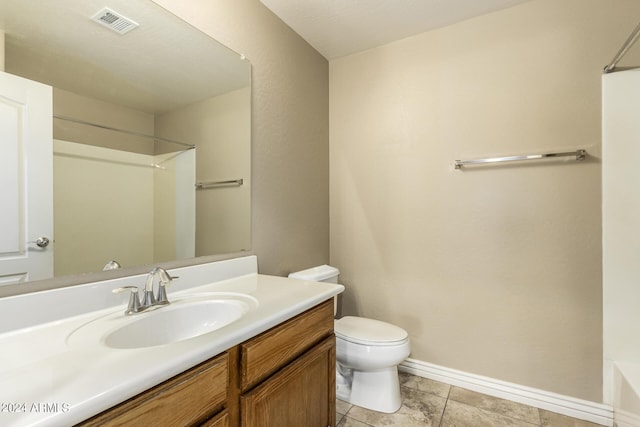 bathroom with baseboards, visible vents, toilet, tile patterned floors, and vanity