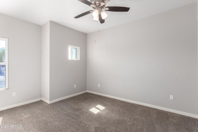 unfurnished room with ceiling fan and carpet flooring