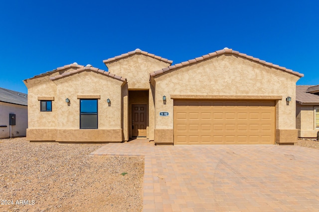 view of front of property featuring a garage