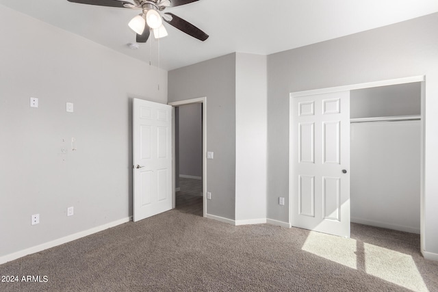 unfurnished bedroom featuring carpet floors, a closet, and ceiling fan