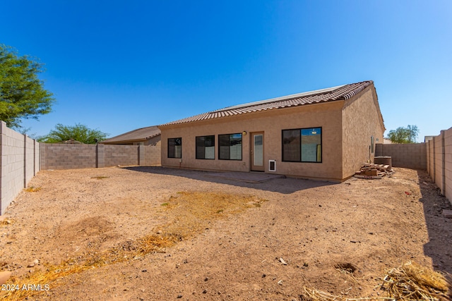 back of property featuring a patio