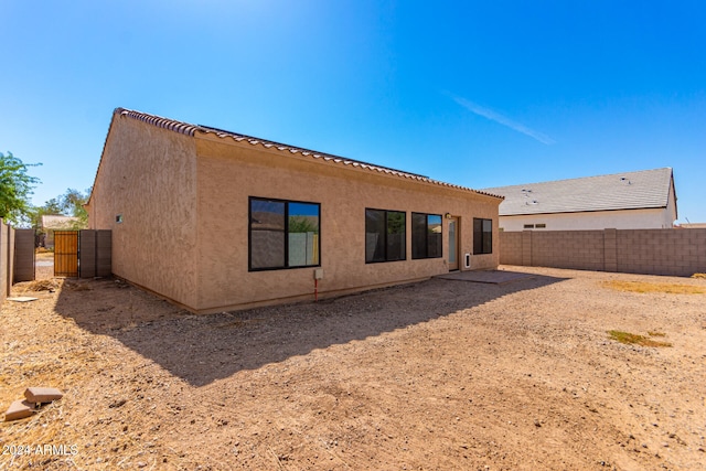 back of property featuring a patio