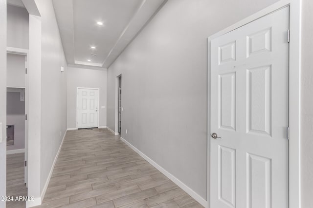 corridor featuring light hardwood / wood-style floors